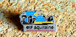 Pin's AUTOMOBILE SPORT F1 - Essence ELF Aquitaine - Peint Cloisonné  - Fabricant EBC 92 - F1