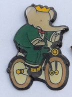 AN12 Pin's ANIMAUX ELEPHANT BABAR à VELO CYCLISME Achat Immédiat - BD