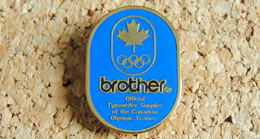 Pin's INFORMATIQUE TECHNOLOGIE - Imprimante BROTHER JO CANADA Team Olympic - Peint Cloisonné - Fabricant ARTISS REGINA - Informática