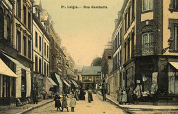Delcampe - LAIGLE - Rue Gambetta - Nombreux Commerces - Animé - Carte Toilée Colorisée - L'Aigle