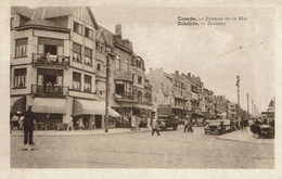 Delcampe - KOKSIJDE-COXYDE-ROUTE ROYALE -AVENUE DE LA MER-CONFISERIE VERDONCK-PHARMACIE-AGENT DE POLICE-AUTOMOBILES - Koksijde