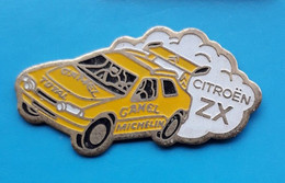 Pin's - Citroën ZX - Rallye - Inscriptions Camel Total Et Michelin - Voiture Jaune Avec Nuage De Poussière - Citroën