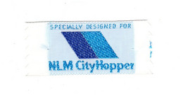 13809" NLM CITYHOPPER  (DUTCH COMMUTER AIRLINE)-TEXTIEL GEWEVEN " Cm. 2,8 X 6,5 - Advertisements