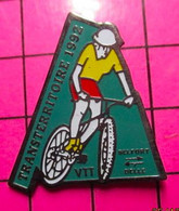 313G Pin's Pins / Beau Et Rare / THEME : SPORTS / CYCLISME VTT TRANSTERRITOIRE 1992 BELFORT BELLE - Cyclisme