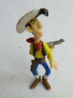 FIGURINE LUCKY LUKE PLASTOY 1997 LUCKY LUKE Tire Dans Son Dos TBE (2) - Andere & Zonder Classificatie