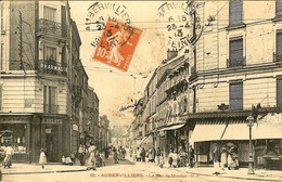 93 AUBERVILLIERS LA RUE DU MOUTIER TRES COMMERCANTE PHARMACIE DELOYE BOUCHERIE COIFFEUR EN 1913 - Aubervilliers