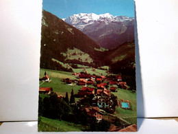Kiental - Dorf Mit Blümlisalpgruppe. Neues öffentl. Schwimmbad 28°. AK Farbig, Gel. 1985.  Panoramablick über - Dorf