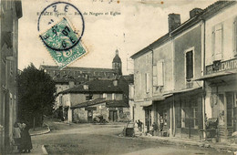 Eauze * La Rue De Nogaro Et Vue Sur L'église Du Village * Commerces Magasins - Other & Unclassified