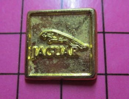 413c Pin's Pins / Beau Et Rare / THEME : AUTOMOBILES / METAL JAUNE LOGO JAGUAR - Jaguar