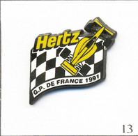 Pin's Automobile - Formule 1 / Grand Prix De France 1991 - Sponsor Hertz. Estampillé AMC 93. Zamac. T860-13 - F1