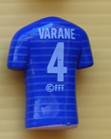 Fève  2022 -  Maillot De Foot FFF N° 4 - Varane - Sports