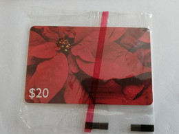 GRENADA  $ 20,- CHIP CARD POINTSETTIA/ C&W CARIBBEAN GENERAL CARD   /MINT IN WRAPPER  (RRRR)         **9495** - Granada