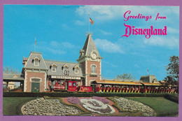 Greetings From Disneyland - Guests Entering Are Greated By A Floral Mickey Mouse And The Santa Fe And Dysneyland Depot - Disneyland