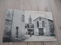 CPA  09 Ariège Oust La Grande Rue Et Clocher De L'église - Oust