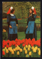 (RECTO / VERSO) LISSE HOLLAND - N° 7404 - KEUKENHOF - JEUNES FEMMES EN COSTUMES - FOLKLORE - CPSM GF - Lisse