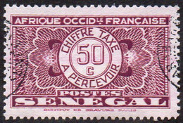 Sénégal Obl. N° Taxe 27 - Pièce De Monnaie Sur Fond Burelé Le 50c Violet - Strafport