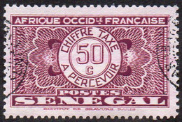 Sénégal Obl. N° Taxe 27 - Pièce De Monnaie Sur Fond Burelé Le 50c Violet - Timbres-taxe