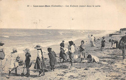 Luc Sur Mer            14        La Plage. Les Enfants Jouent Dans  Le Sable         (voir Scan) - Luc Sur Mer