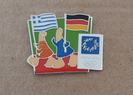Athens 2004 Olympic Games - Mascots With E.U. Flags, Greece - Germany Flags Pin - Jeux Olympiques