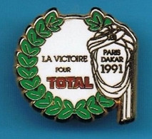 PIN'S //  ** PARIS DAKAR / 1991 / LA VICTOIRE POUR TOTAL ** . (Arcane Paris Patent) - Rallye