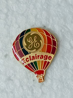 Pin's Montgolfière GE Eclairage - Pins Logo Général Electric Lighting - Pin Electricité - Fesselballons