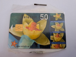 PORTUGAL   CHIPCARD  50 Units  BABY IN WATERLELY / FLOWER MINT CARD IN WRAPPER     **11134** - Portugal