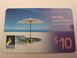 BERMUDA  $10,-,-NORTH ROCK   BERMUDA / PARASOL ON BEACH /  DIFFERENT BACK/   PREPAID CARD  Fine USED  **11269** - Bermudas