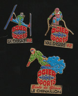 75789-série De 3 Pin's.Ogier Sports.le Chinaillon.la Clusaz.Val D'Isère.signé Charly Pin's. - Sports D'hiver