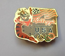 H210 Pin's KELLOGG'S Le Tigre USA JO Jeux Olympiques Olympic Games Achat Immédiat - Jeux Olympiques