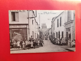 44 - LEGE - La Rue De L'église Et L'église - Les Docks De L'Ouest - Legé