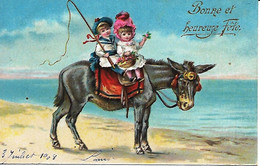 Unknown  Artist  -  Happy Holidays : Little Boy In Sailor Suit & Little Girl In Red Bonnet On Back Of Donkey On Sands, - Saint-Patrick's Day
