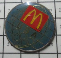 916a Pin's Pins / Beau Et Rare / McDONALD'S / Pin's USA Mc PLANETE GLOBE TERRESTRE ANNEAUX OLYMPIQUES - McDonald's