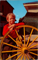 Greetings From The Amish Country Pennsylvania With Amish Boy Resting On Wheel Of Buggy - Souvenir De...