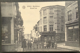 GEMBLOUX Grand’rue Animée, Magasins, Enseignes. 1 CP Postée En 1913 - Gembloux