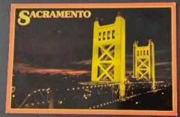 WORLDWIDE OLD POSTCARD. SACRAMENTO,CALIFORNIA.THE TOWER BRIDGE IS STARKLY CONTRASTED AGAINST A DARKENING SKY .MINT - World