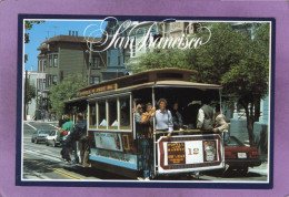 CA SAN FRANCISCO  One Of The City's Famous Cable Cars Passes A Row Of Victorian Homes - San Francisco