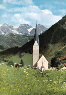 1 AK Österreich / Vorarlberg / Kleinwalsertal * Kath. Pfarrkirche Hl. Jodok - Davor Die Lourdeskapelle In Mittelberg * - Kleinwalsertal