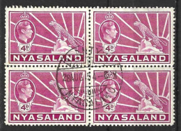 NYASALAND...KING GEORGE  VI...(1936-52..).....4d X BLOCK OF 4.....SG135.....(CAT.VAL.£8..)....CDS...VFU... - Nyassaland (1907-1953)