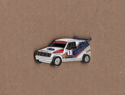 Pin's Rallye Paris Le Cap 92 / Misubishi Rothmans Michelin Shell Facom Sonauto (base Argentée Signé Eden Arts Korea) - Automobile - F1