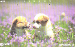Japan:Used Phonecard, NTT, 105 Units, Puppies In Grass, Dogs - Dogs