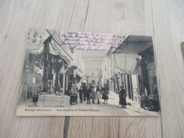 CPA 84 Vaucluse Orange Rue Caristie Et Théâtre Romain Marchand De Cartes Postales - Orange