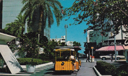 MIAMI BEACH . TRAM CARS TRAVEL THE EXCLUSIVE LINCOLN ROAD MALL ON MIAMI BEACH - Miami Beach