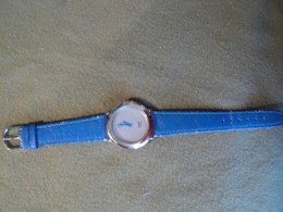 MONTRE PUBLICITAIRE PEUGEOT 106 KID. GENUINE LEATHER. ANNEES 90 / 2000 - Relojes Publicitarios