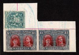 Lot # 818 Rhodesia 1910 -13, King George V “Double Head”: £1 Red & Black Perf 14 Pair, Together With 10s Small Arms - Rhodesia & Nyasaland (1954-1963)