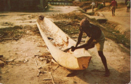 MAKING A DUG OUT CANOE - Liberia