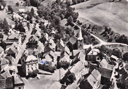 Eglise Neuve D'Entraigues - L'Eglise Et Le Bourg - CPSM °J - Aigueperse