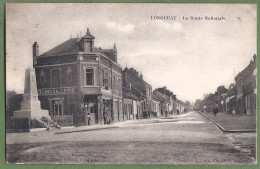 CPA Vue Peu Courante - SOMME - LONGUEAU - LA ROUTE NATIONALE - Petite Animation, La Quincaillerie & Monument Au Morts - Longueau