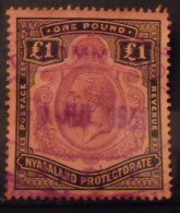 Nyassaland. One Pound, 1£ N° 23 De 1931-32 Oblitéré. Noir Et Violet Sur Rouge. George V - Africa (Other)