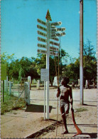 9-12-2023 (1 W 45) Australia - Aboriginal Men At Alice Springs Sign Post (psoted 1970's - No Stamp) - Aborigeni