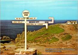 11-12-2023 (1 W 54) UK - Land's End Road Sign (Australia = 12000 Miles Etc) Signpost - Land's End